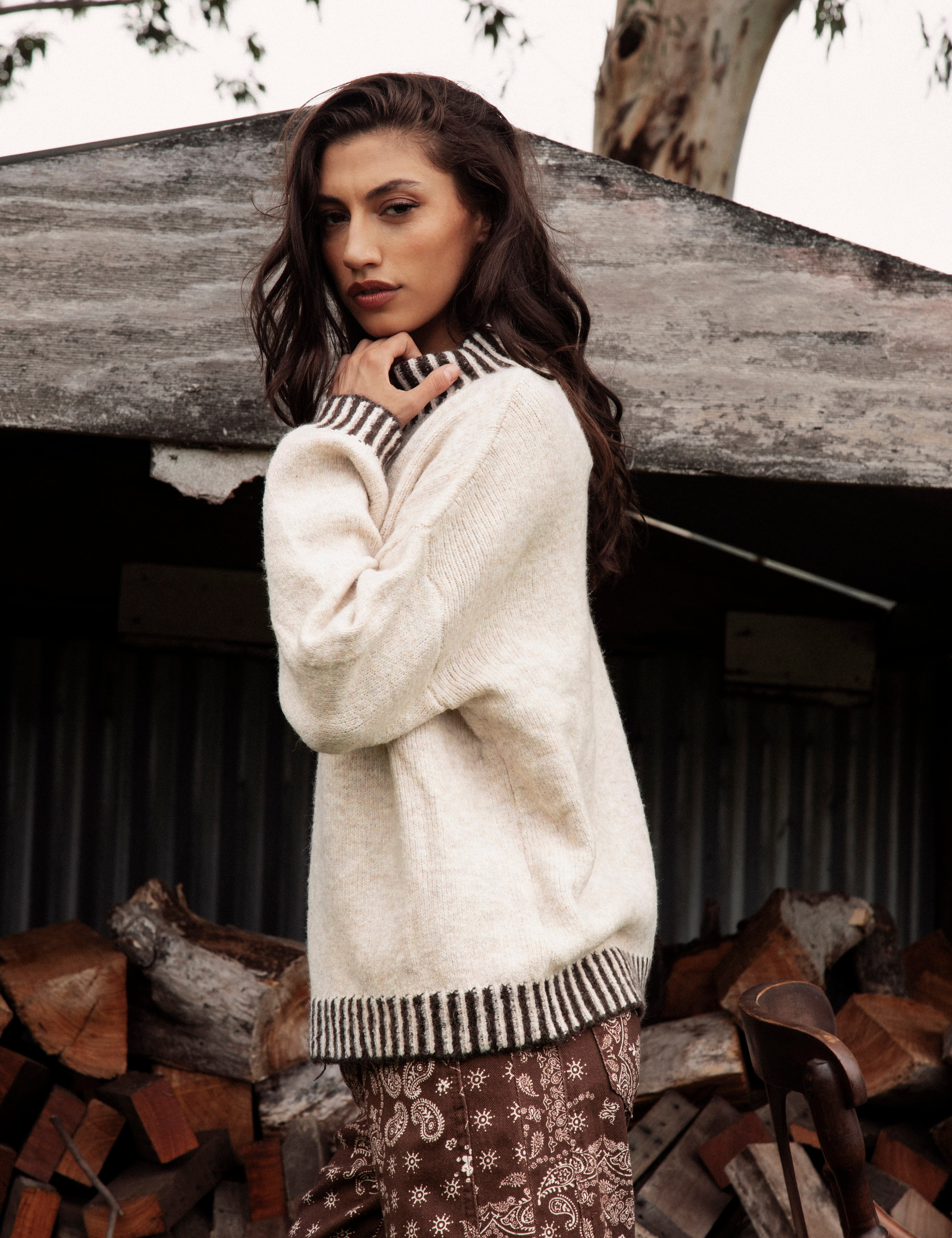 Tilly Knit Chocolate Stripe is a cream sweater with contrasting striped trim at neckline, hem and cuffs.