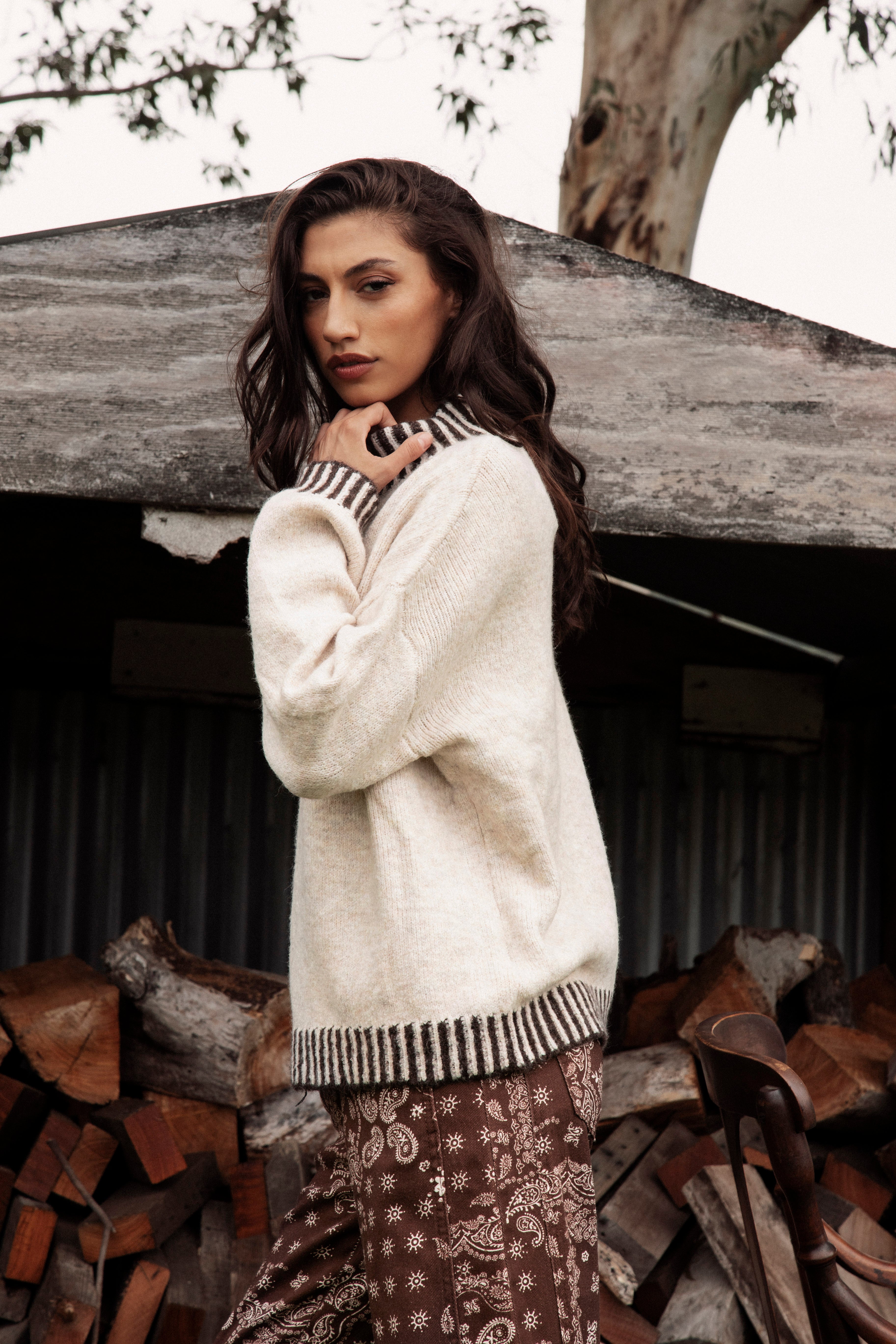 Tilly Knit Chocolate Stripe is a cream sweater with contrasting striped trim at neckline, hem and cuffs.