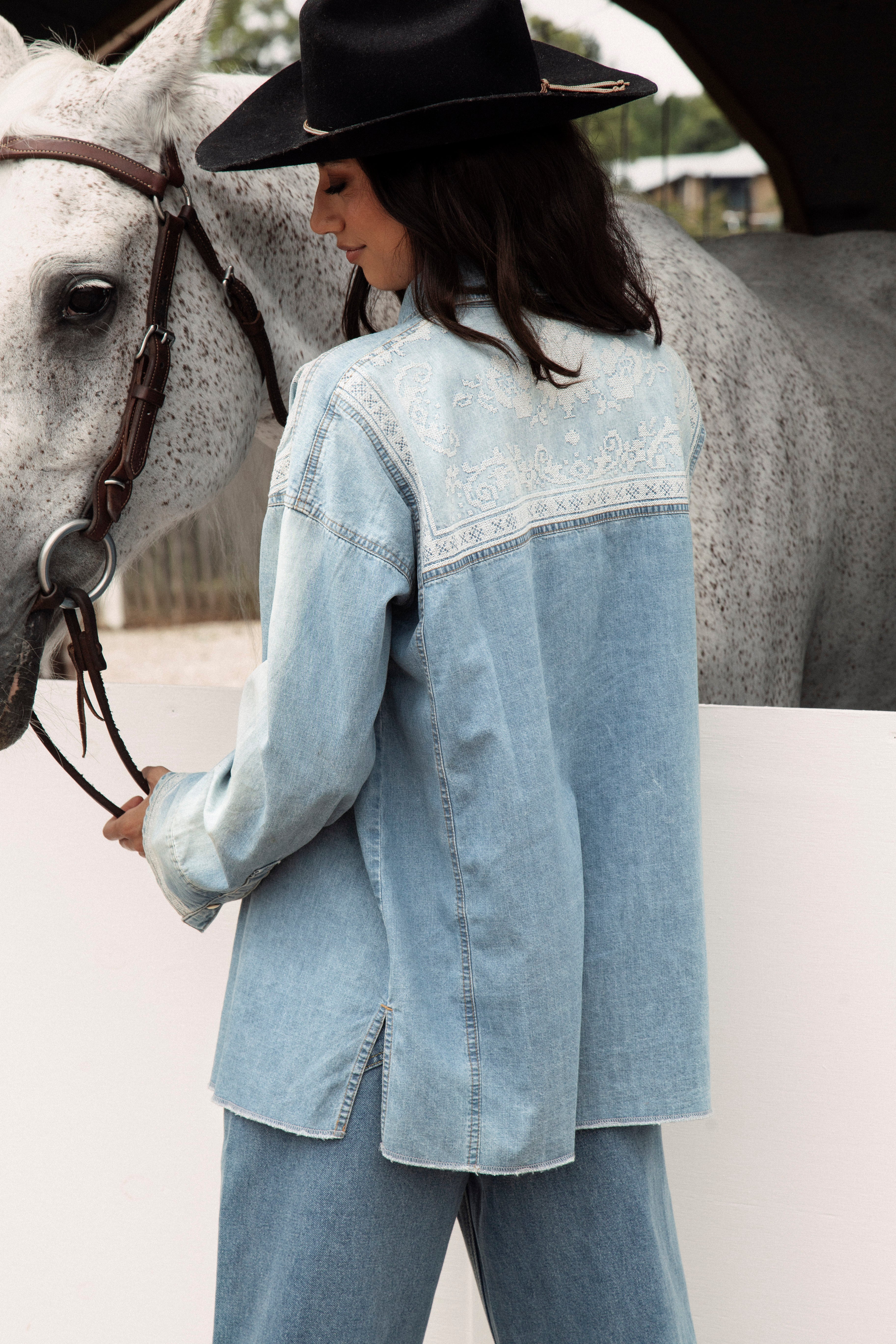 Untamed Denim Shirt - rear view showcasing delicate white embroidery.