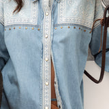 Untamed Denim Shirt close up view of embroidered bodice, brass detail and press stud closure