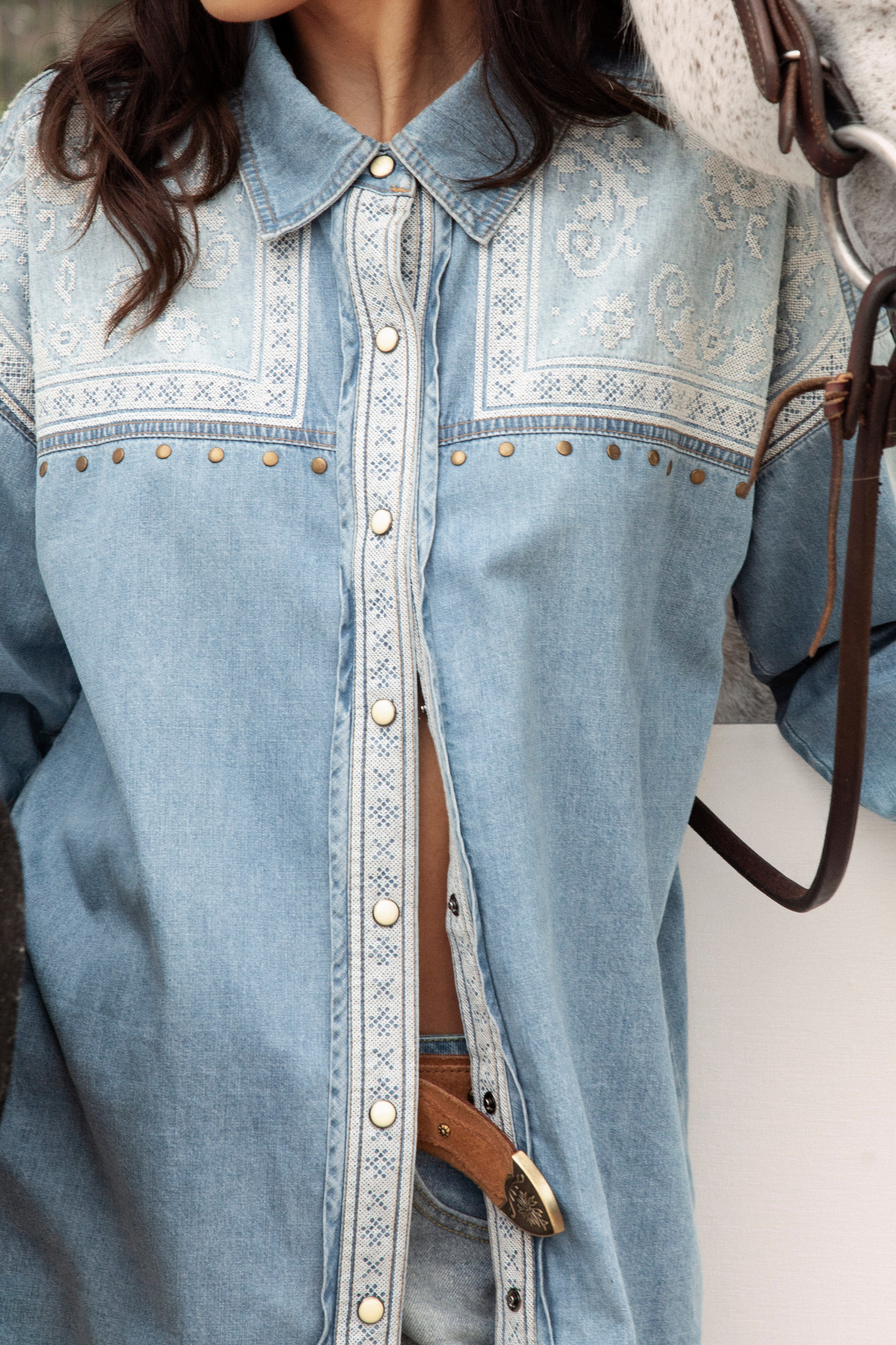 Untamed Denim Shirt close up view of embroidered bodice, brass detail and press stud closure