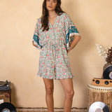 Vida Playsuit featuring floral pattern and wide sleeves with contrasting trim