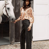 Wild Soul Studded Jean is a black denim jean featuring statement studs down legs