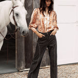 Wild Soul Studded Jean features black denim, wide leg style and statement studs.