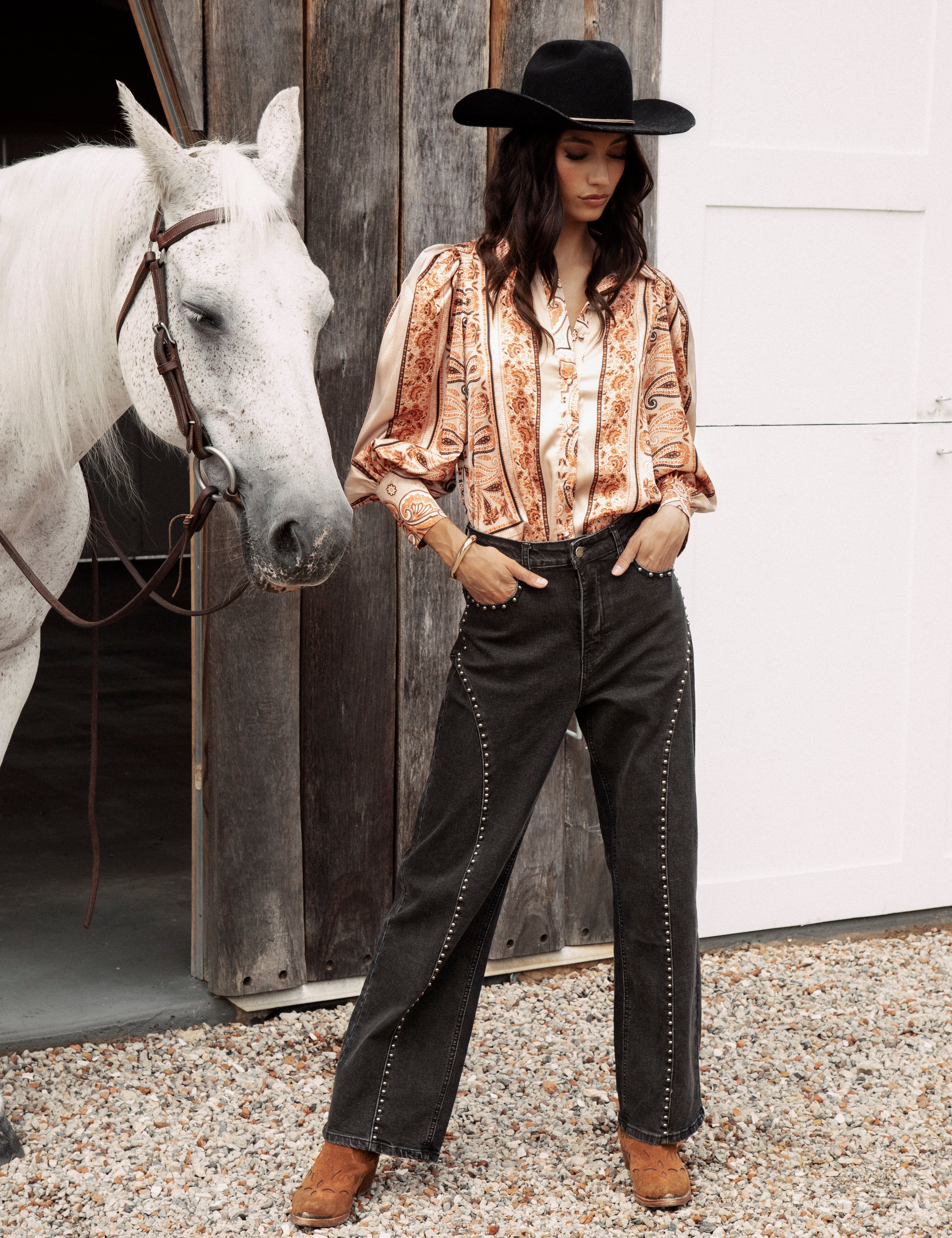Wild Soul Studded Jean features black denim, wide leg style and statement studs.