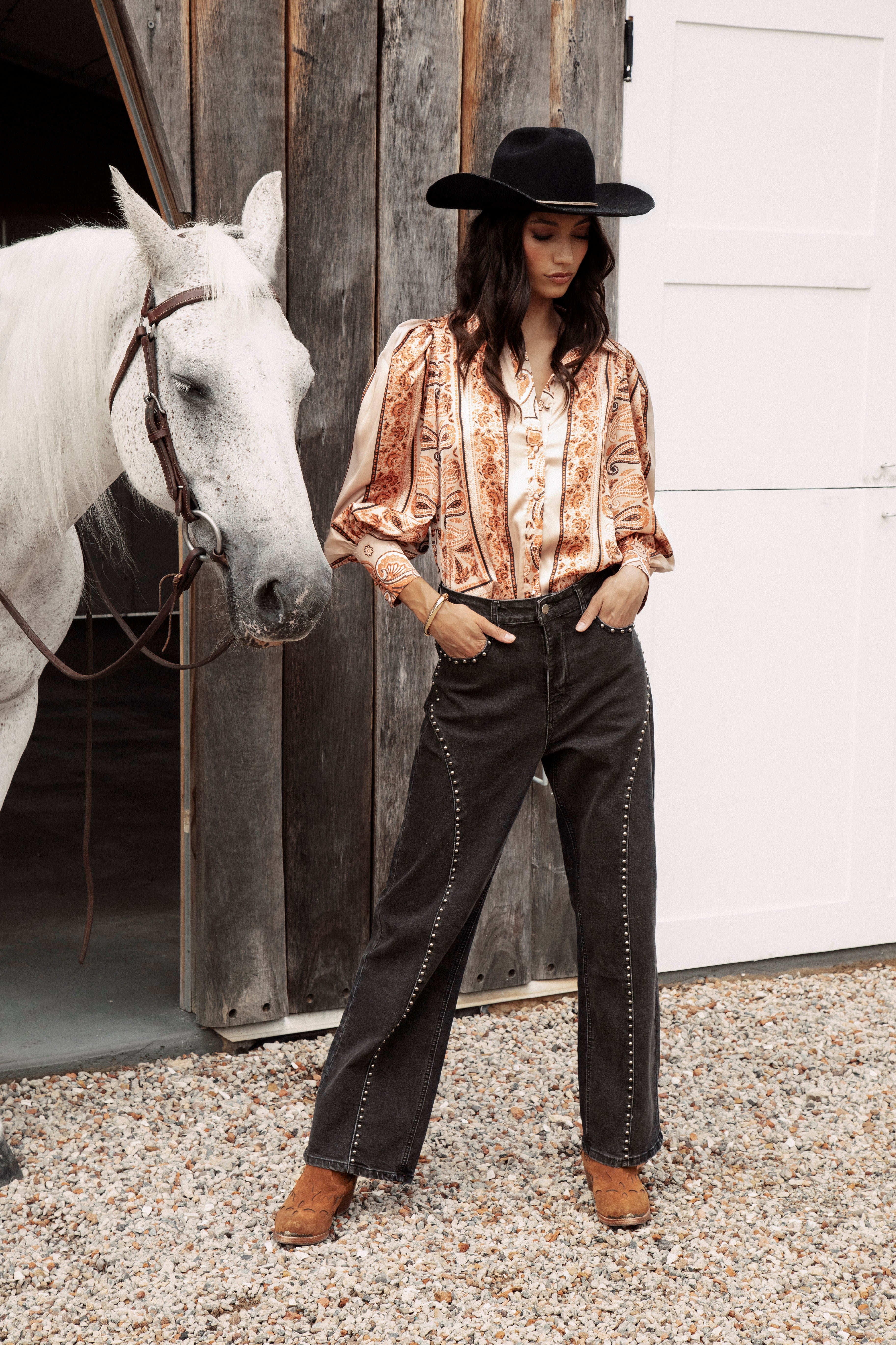 Wild Soul Studded Jean features black denim, wide leg style and statement studs.