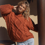 Wildwood Knit Ember features chunky cable knit and beautiful rust colour