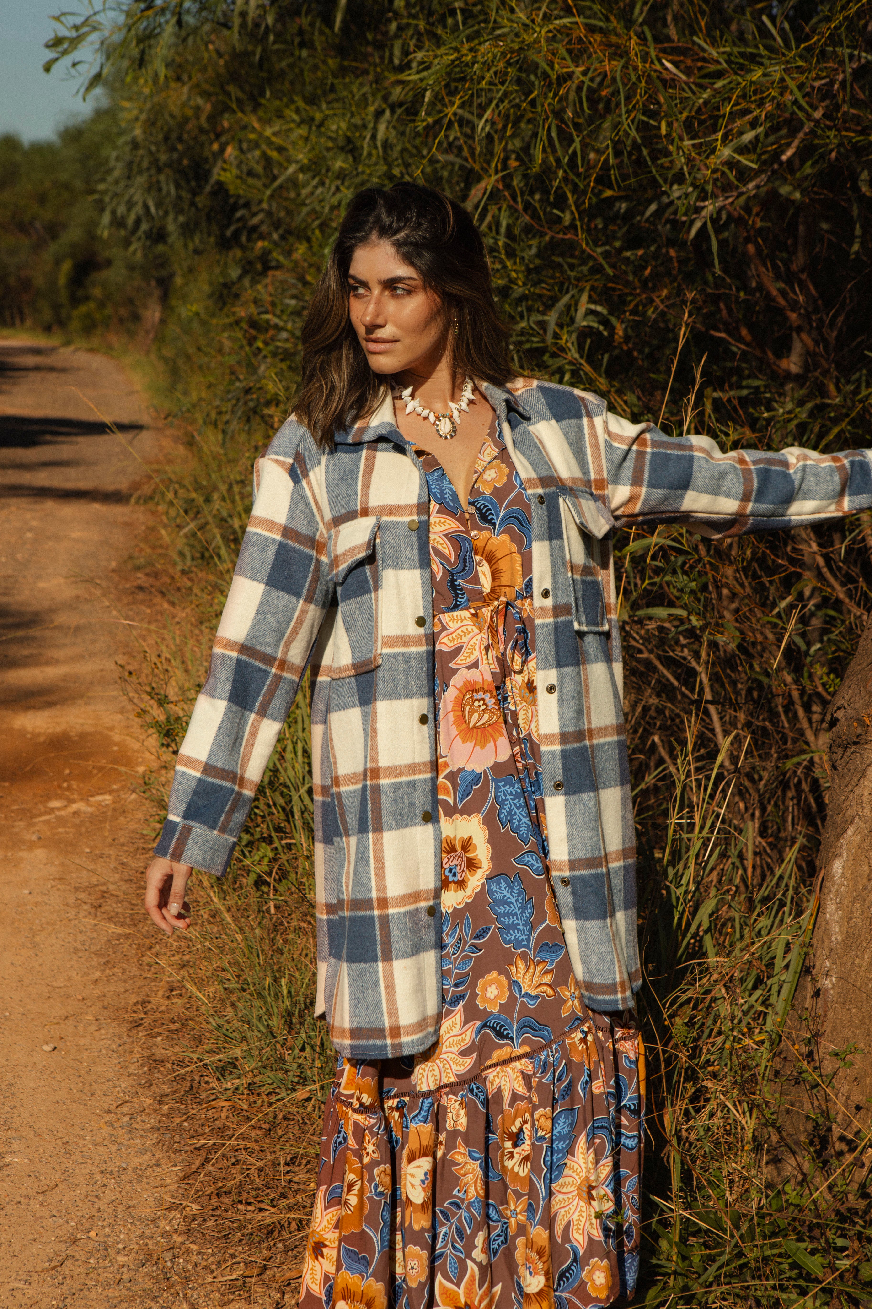 Woodland Shacket Denim is a longline shacket featuring pockets