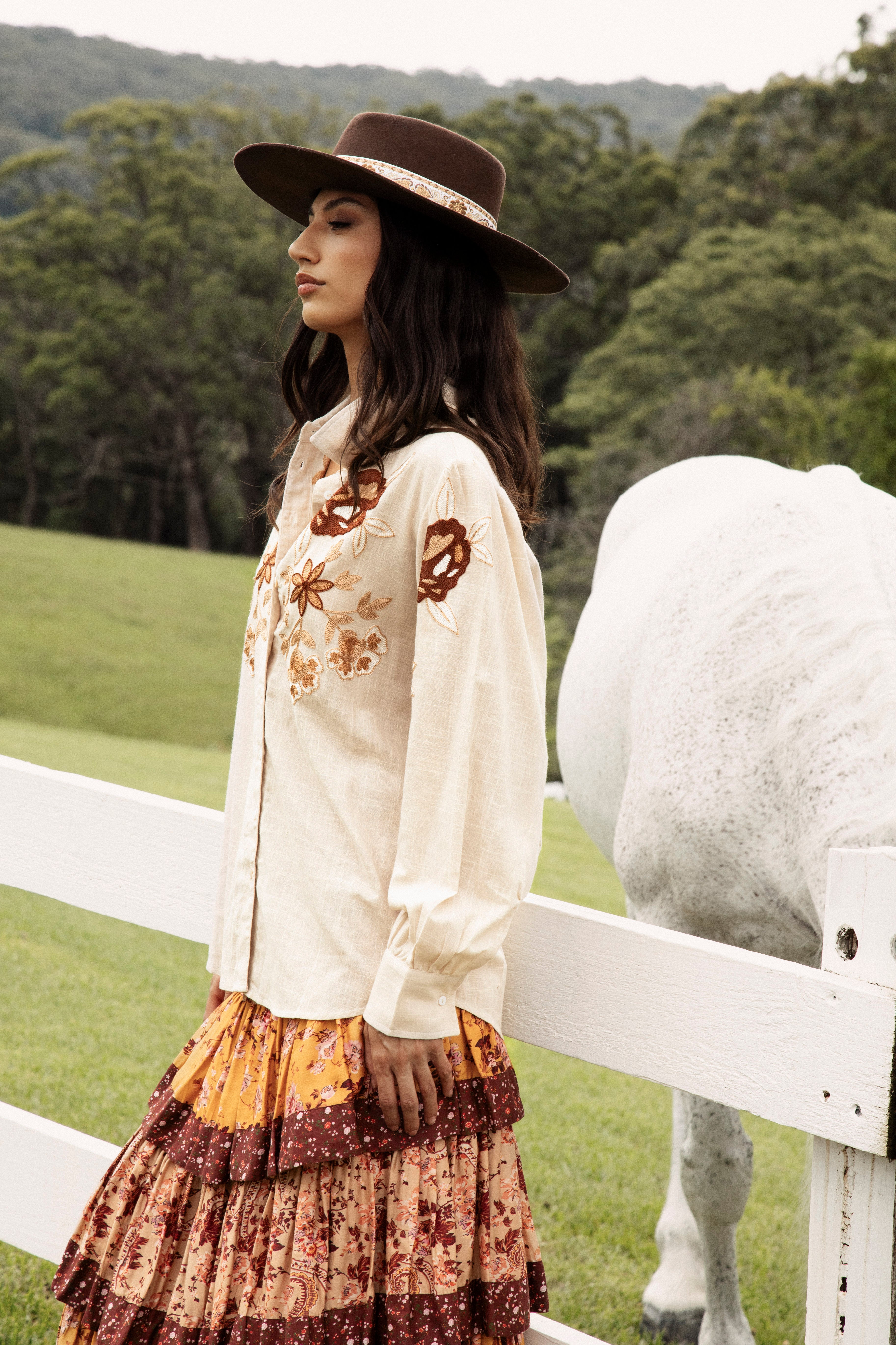 Woodstock Embroidered Shirt is a long sleeve cream coloured shirt featuring floral embroidery in shades of brown.