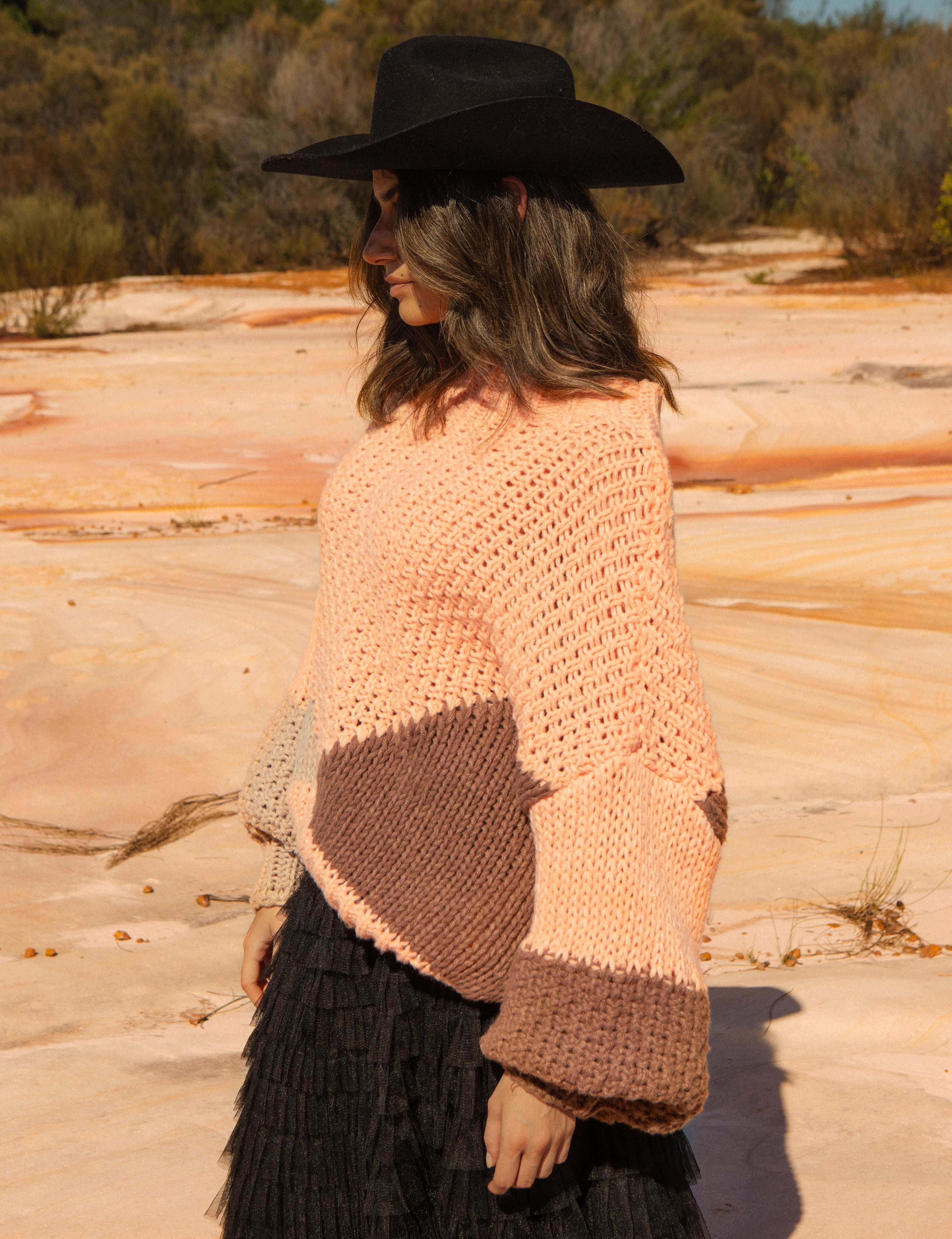 Wrangler Knit - Dune. Side View featuring billowy sleeves and chunky knit.