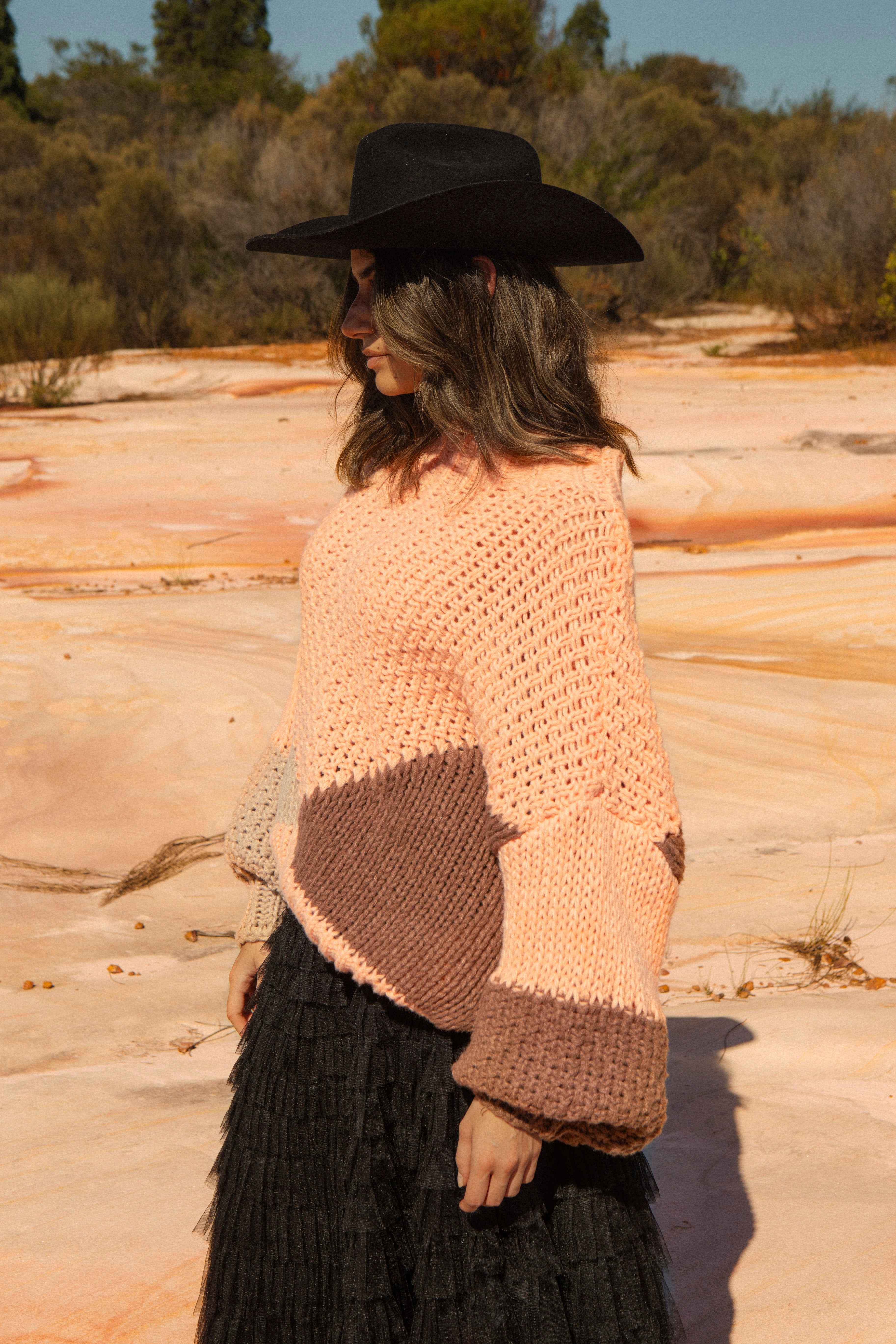 Wrangler Knit - Dune. Side View featuring billowy sleeves and chunky knit.