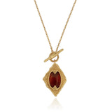 Zelina Necklace - gold chain featuring gold pendant with ruby red jewel