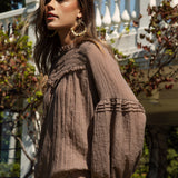 Zimmie Peasant Blouse Chocolate - side view showcasing long sleeves with ruffle detail