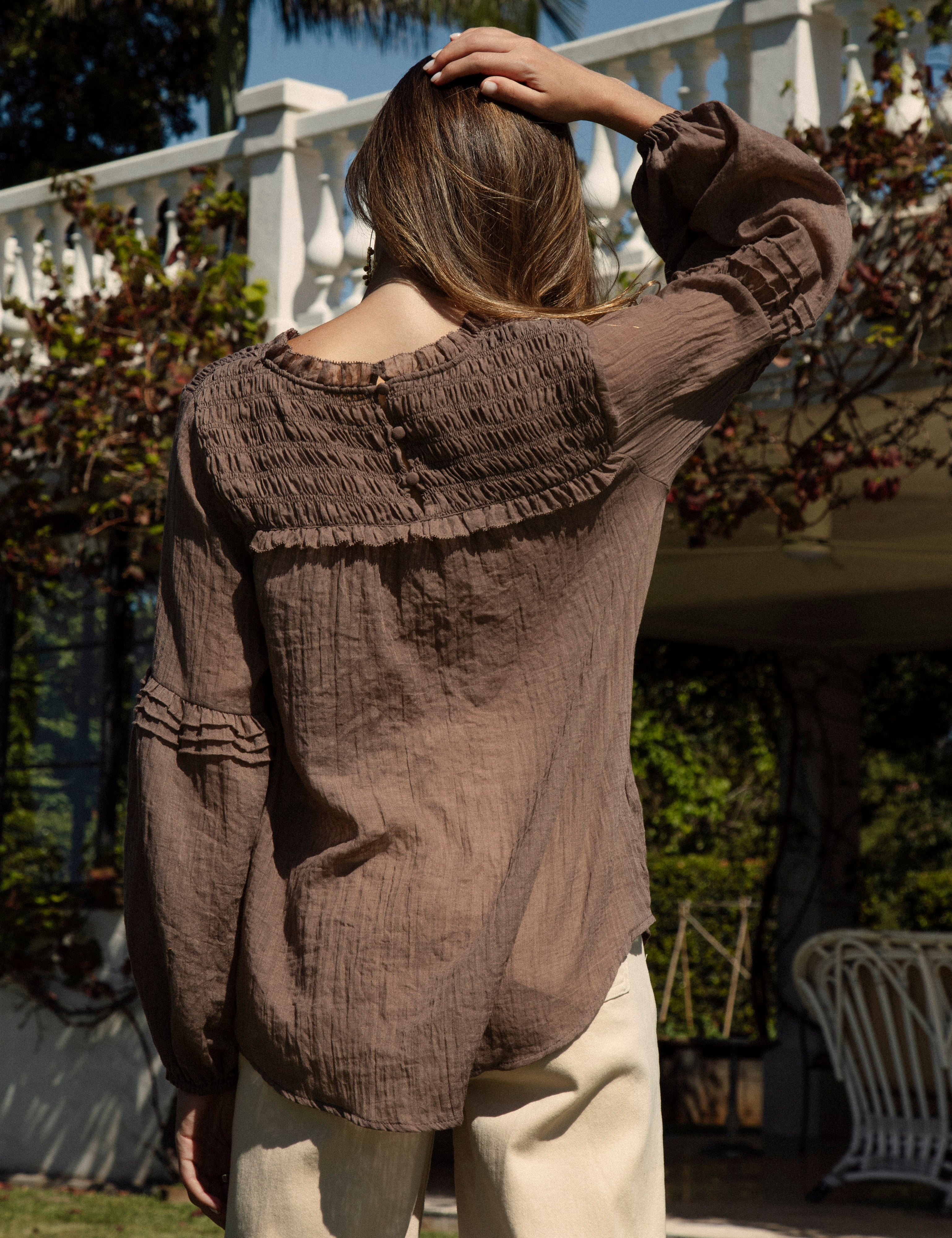 Zimmie Peasant Blouse Chocolate - showcasing shirred bodice at rear