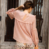 Zimmie Peasant Blouse Peach - rear view showcasing button closure at neck